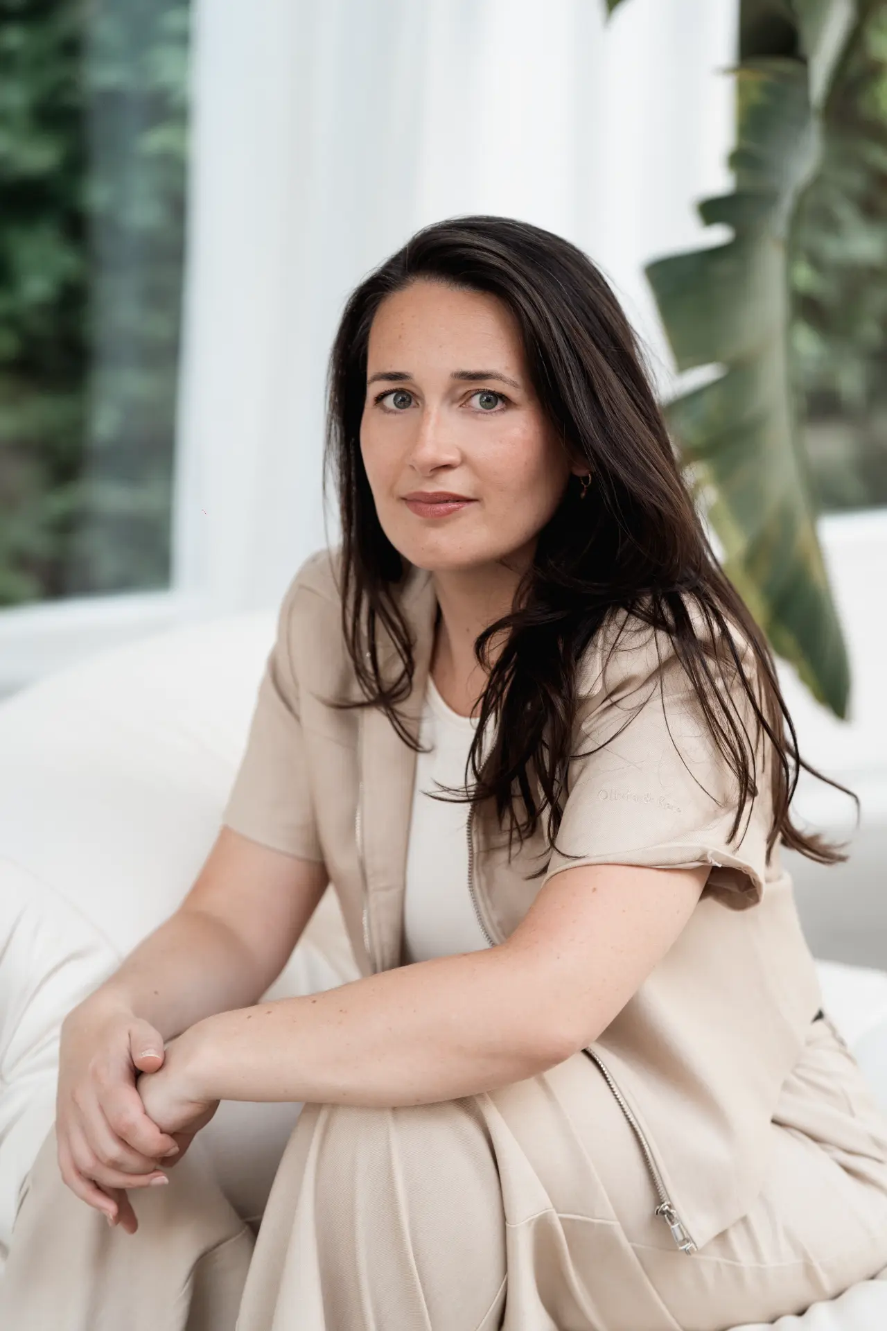 Seated portrait of Suzana in a light interior
