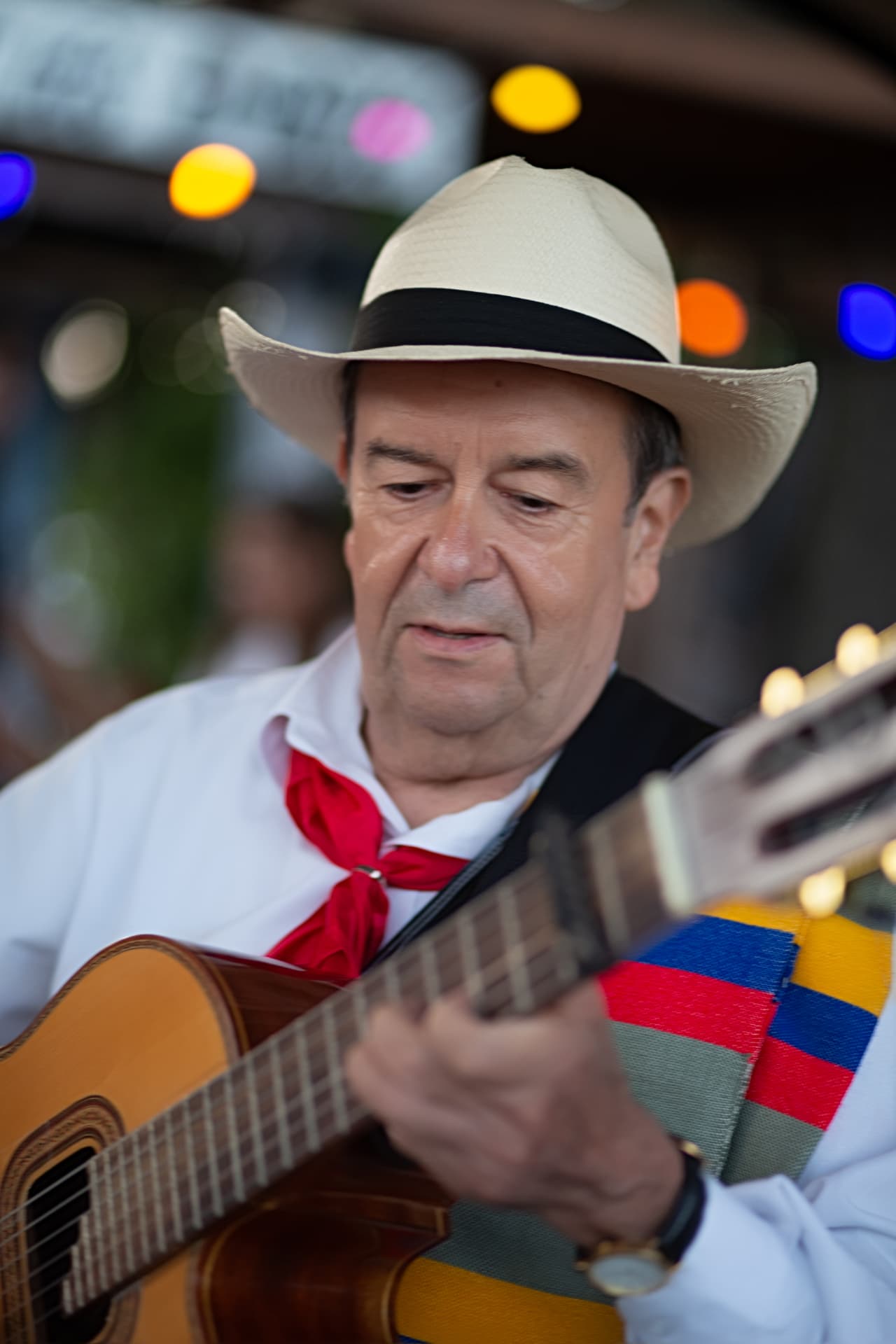 Colombian guitarist performing in traditional dress