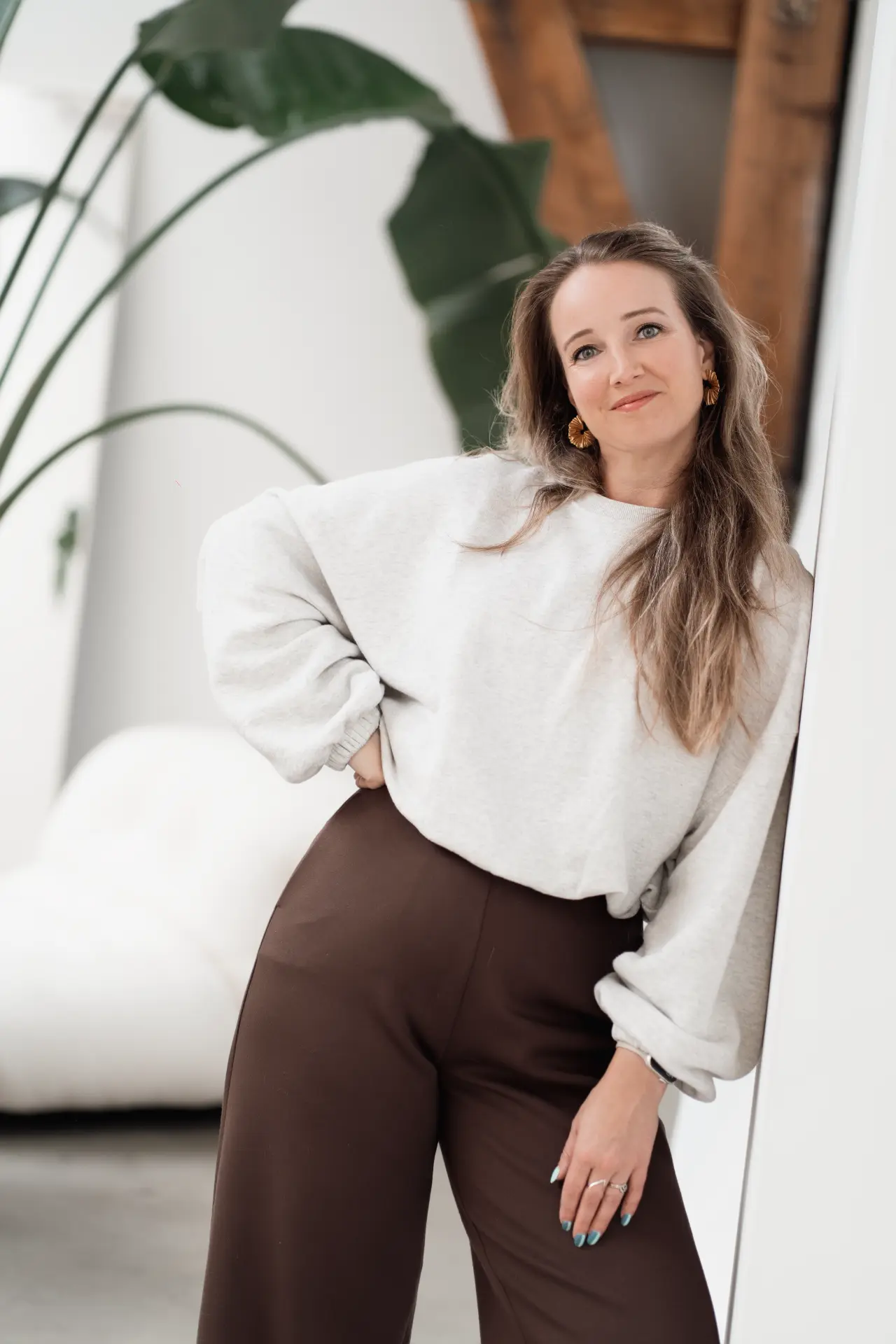 Marina standing in a light interior