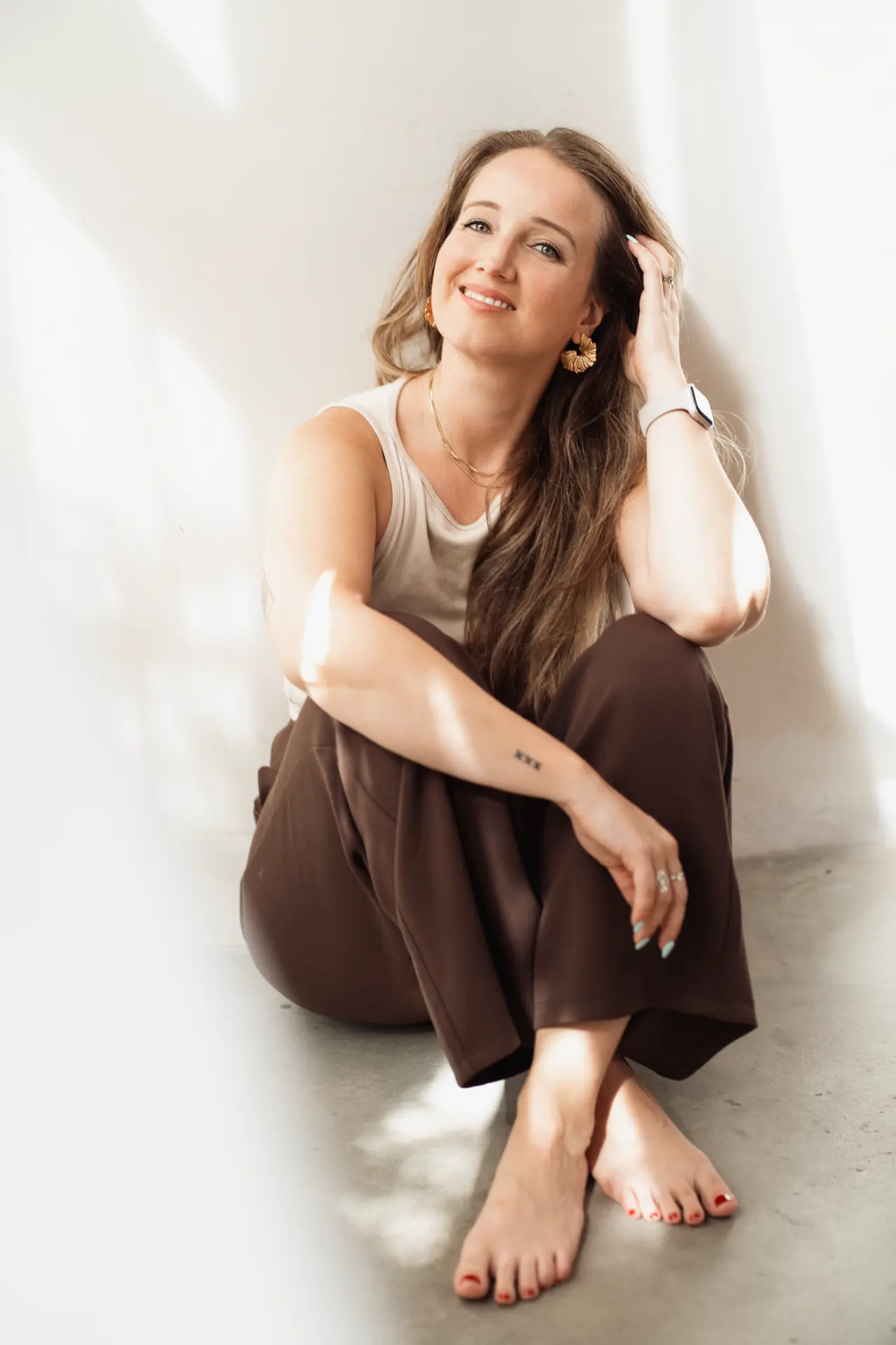 Marina seated in soft sunlight