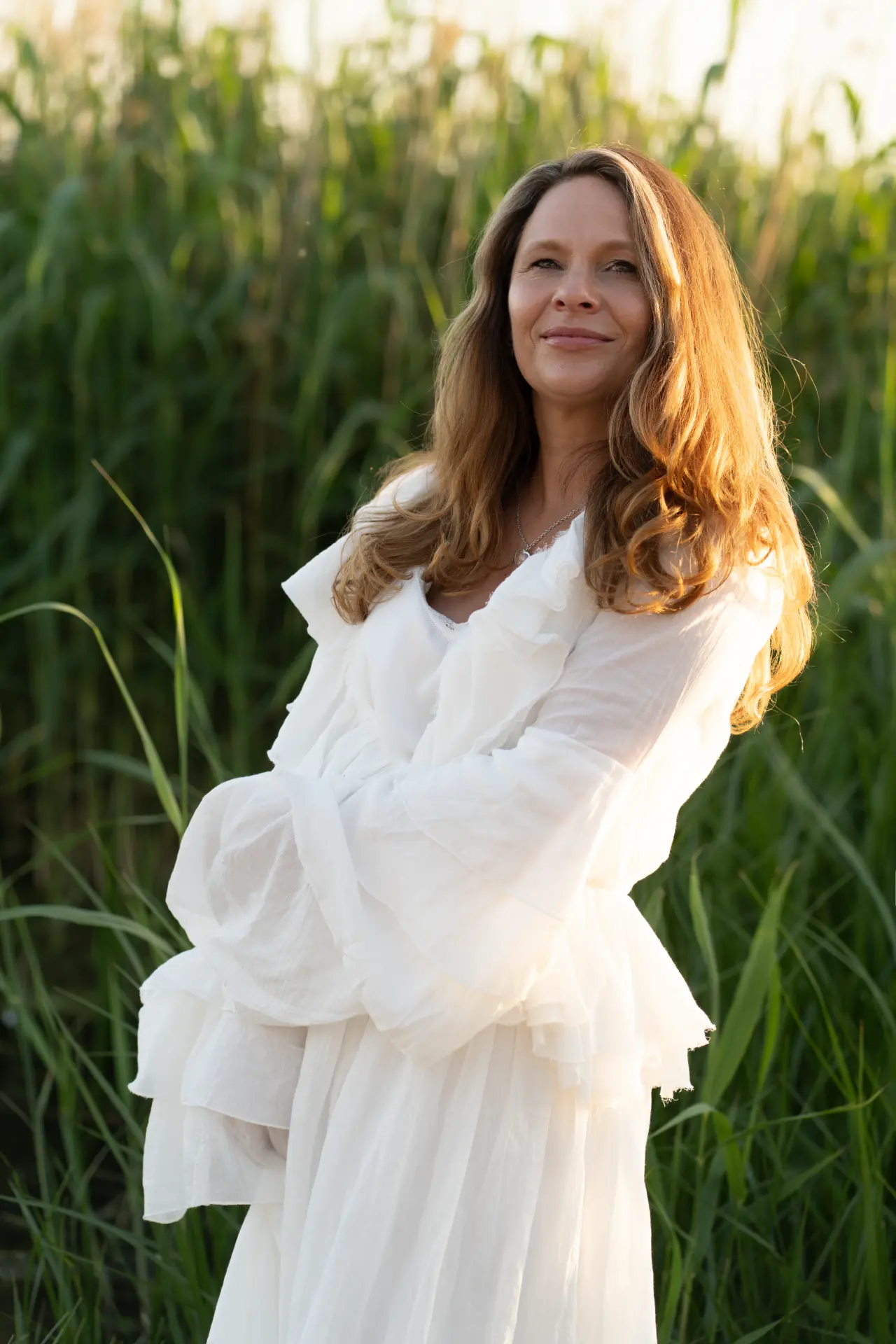 Marjolijn standing among tall reeds