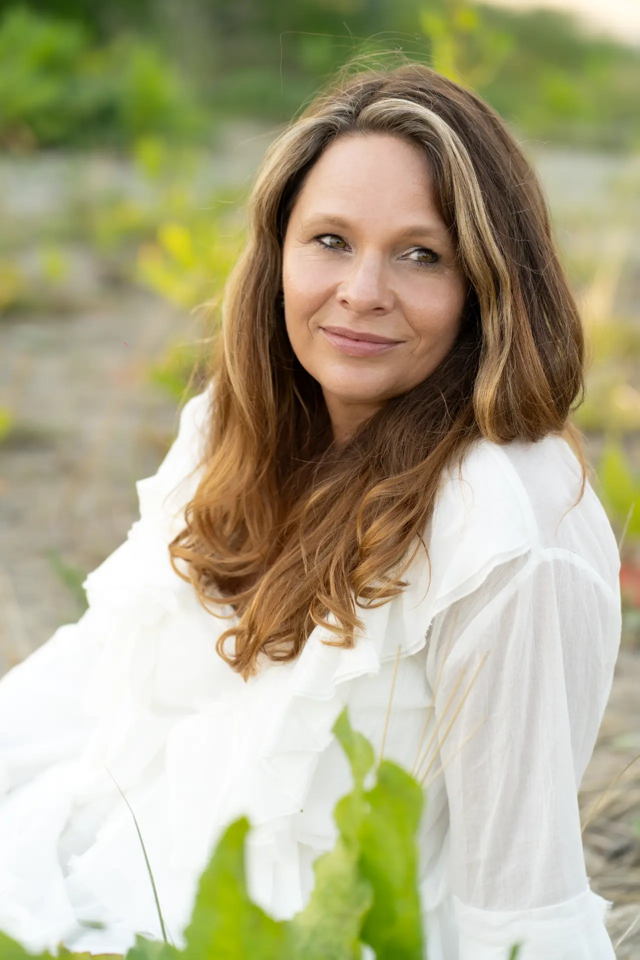 Marjolijn seated among soft greenery