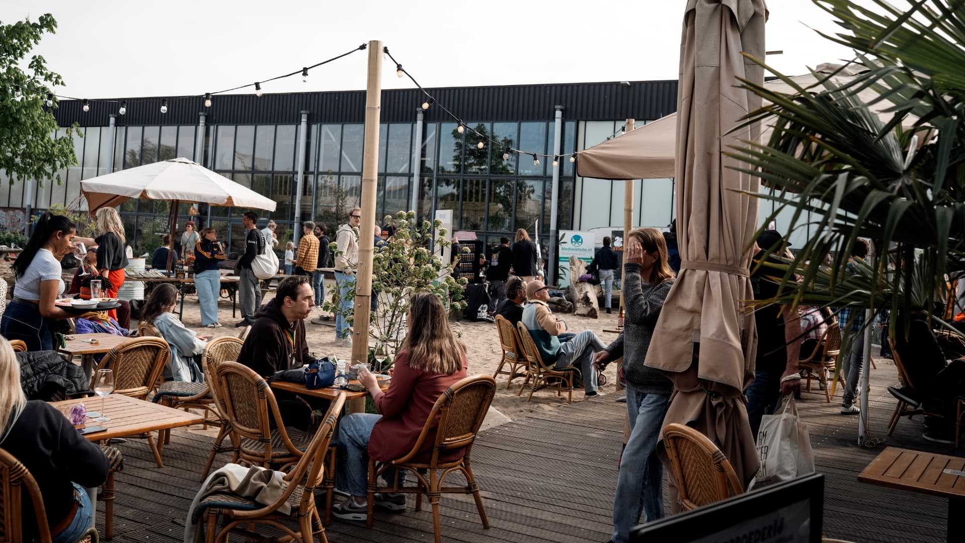 Guests relaxing on the terrace under parasols