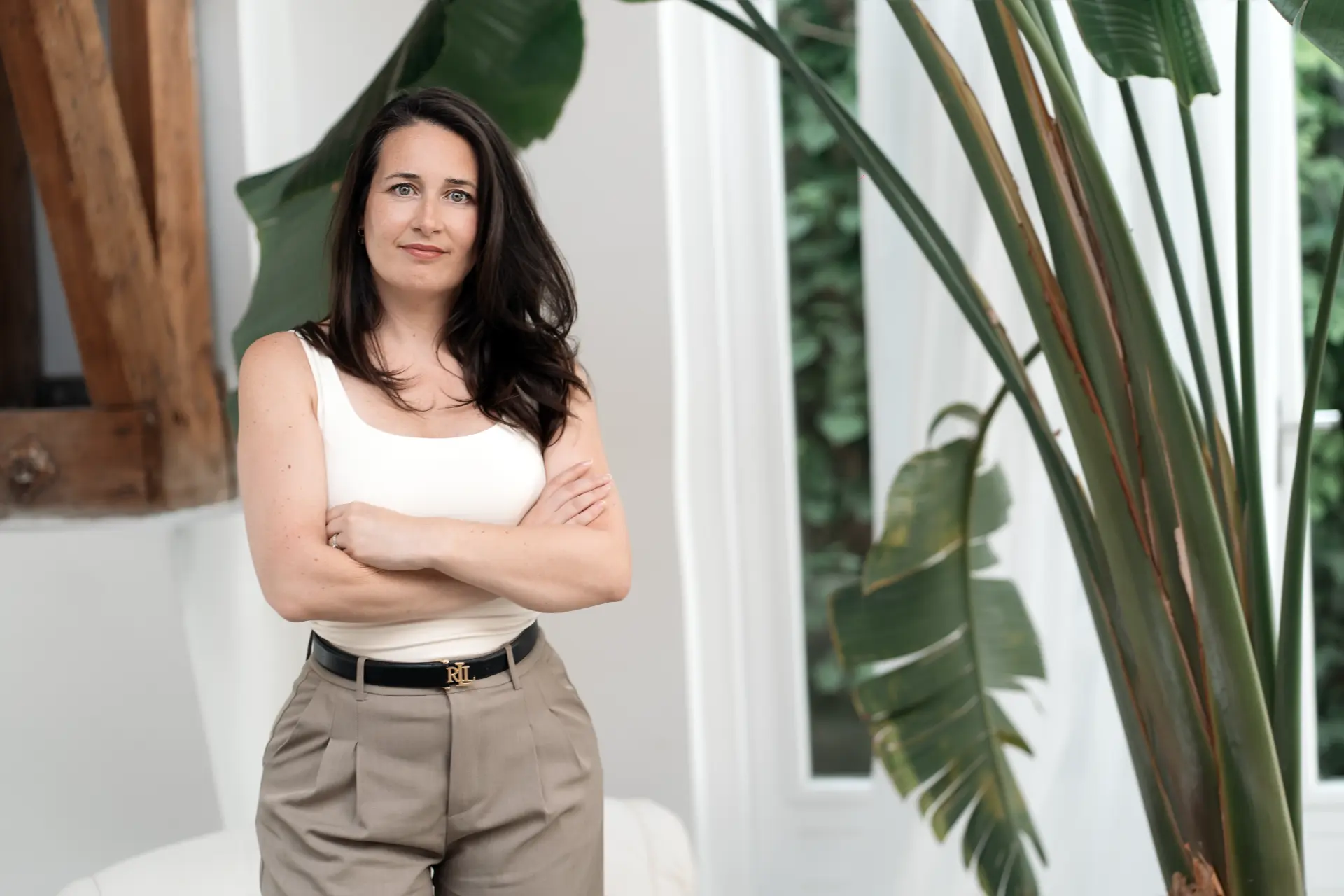 Suzana standing among architectural plants