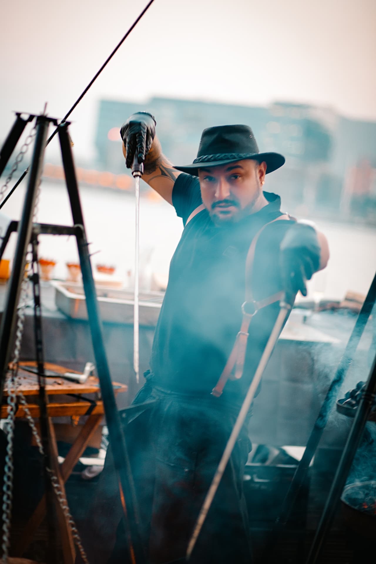Portrait of the chef working through smoke from the grill