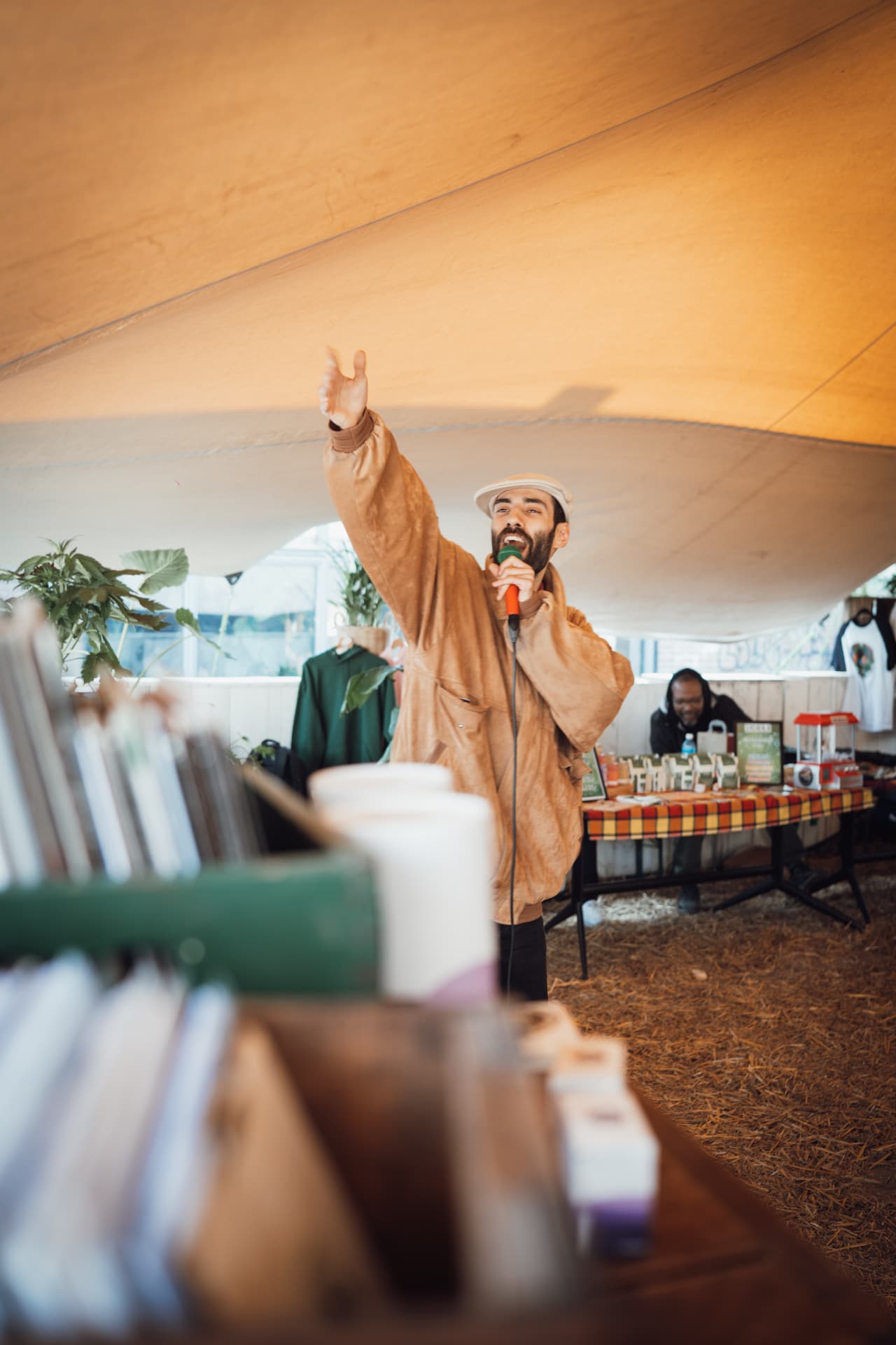 Speaker addressing the tent with a microphone