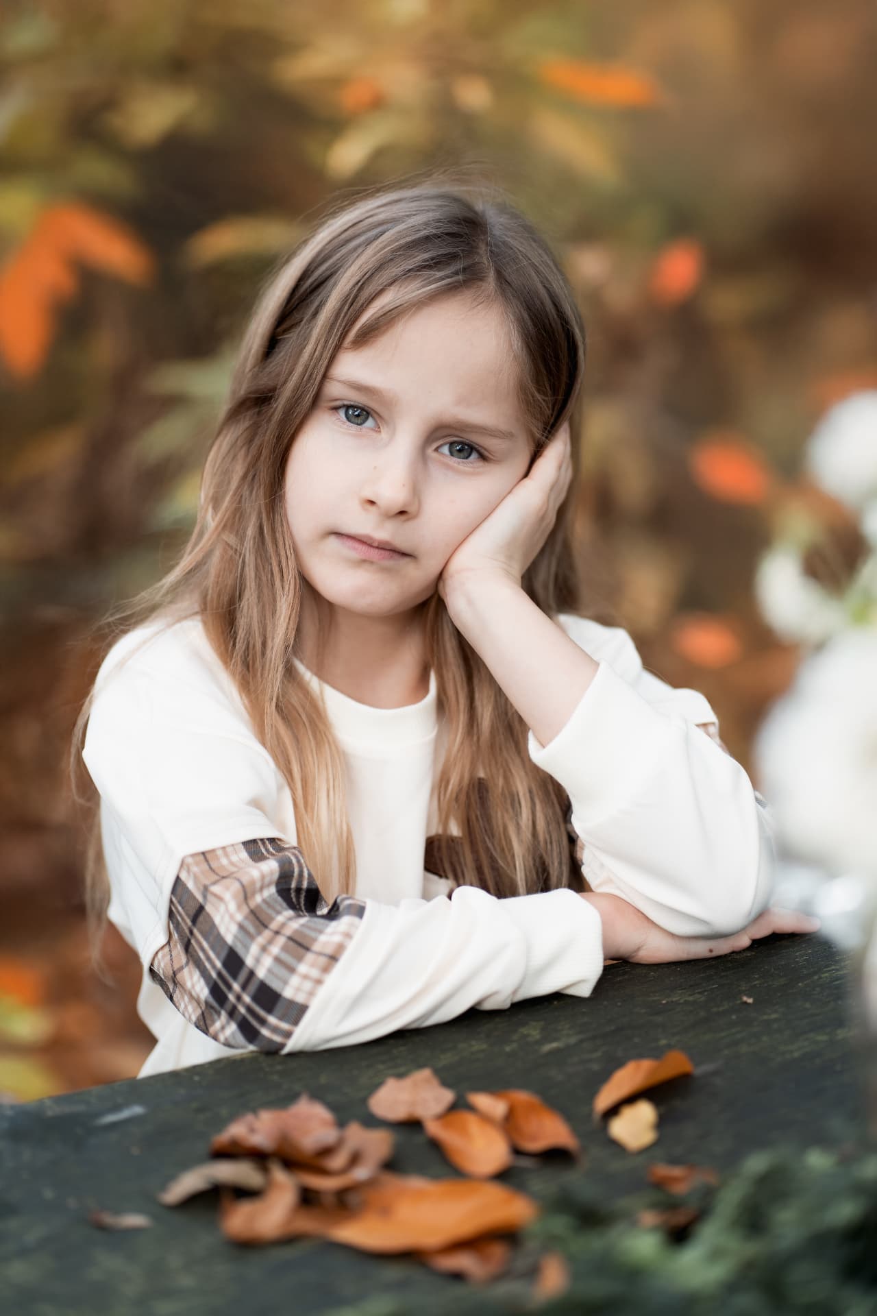 Girl seated at an autumn tea table