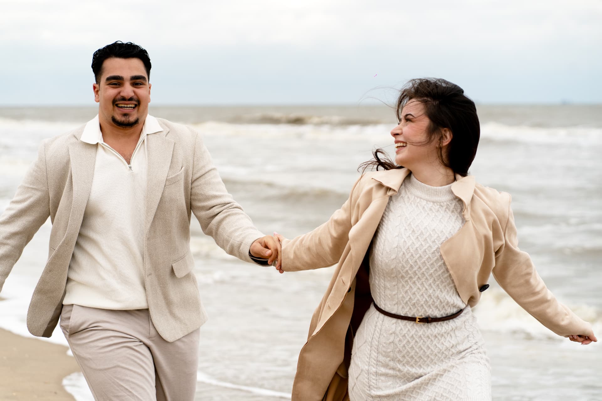 N and Y laughing together at the water's edge