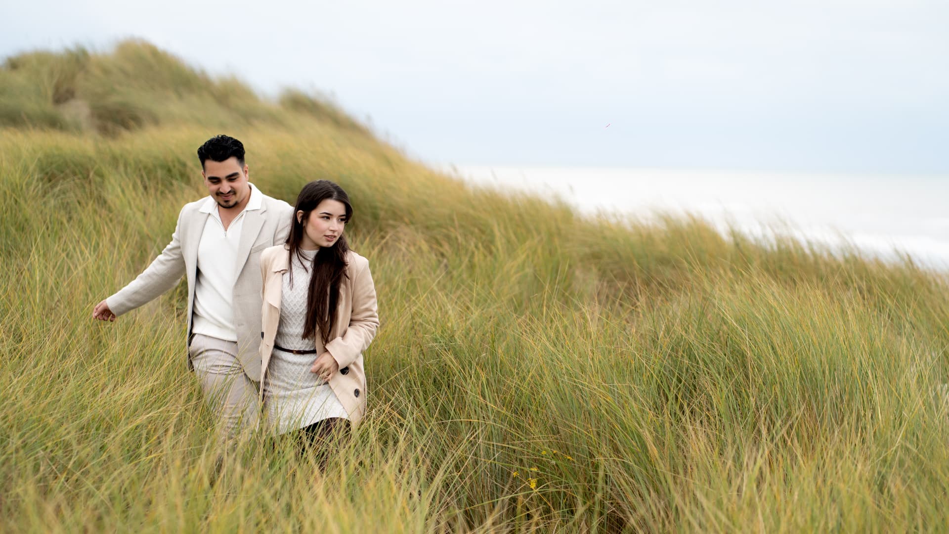 N and Y walking through the coastal dunes