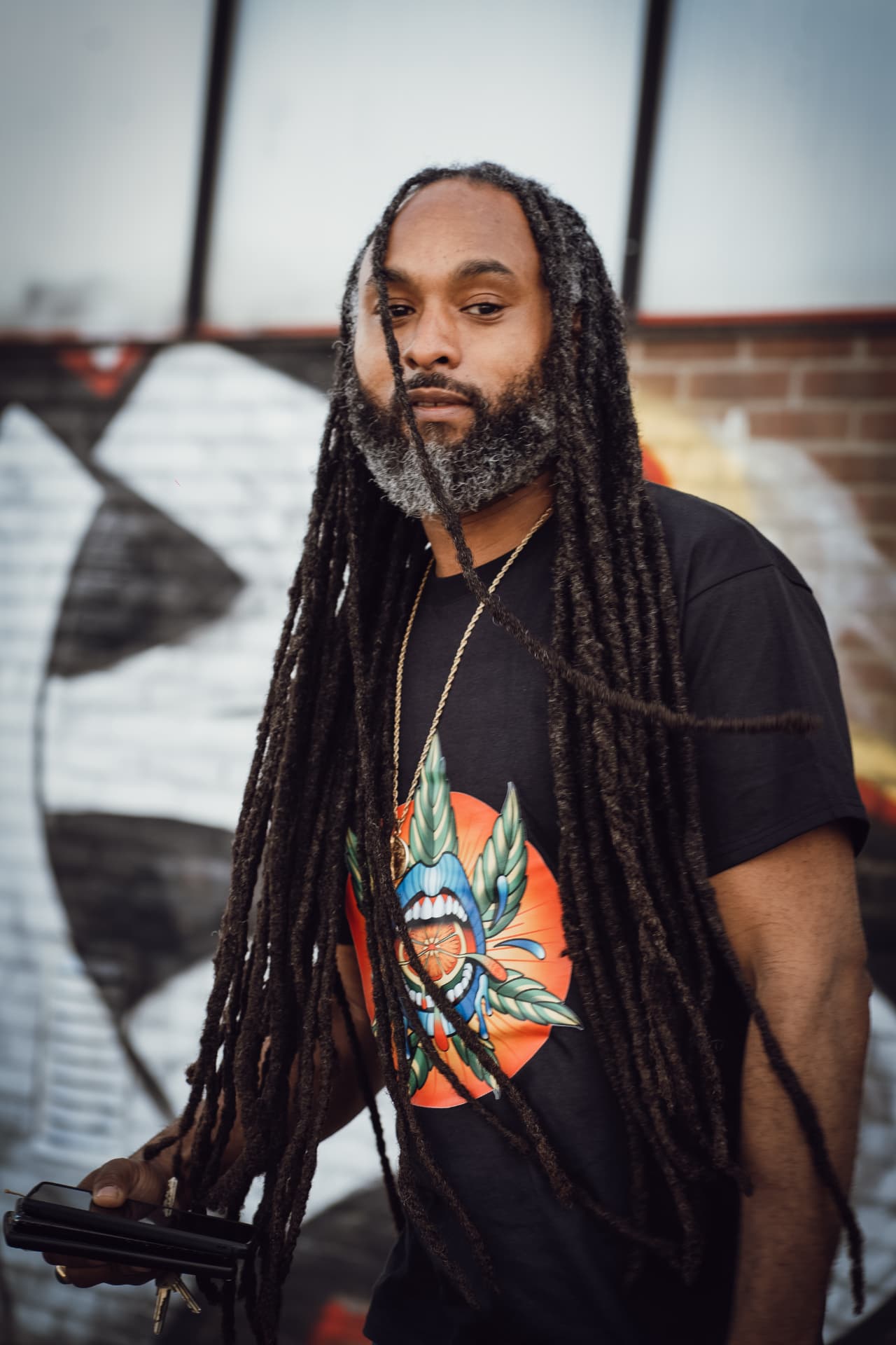 Portrait of a guest in a graphic black t-shirt