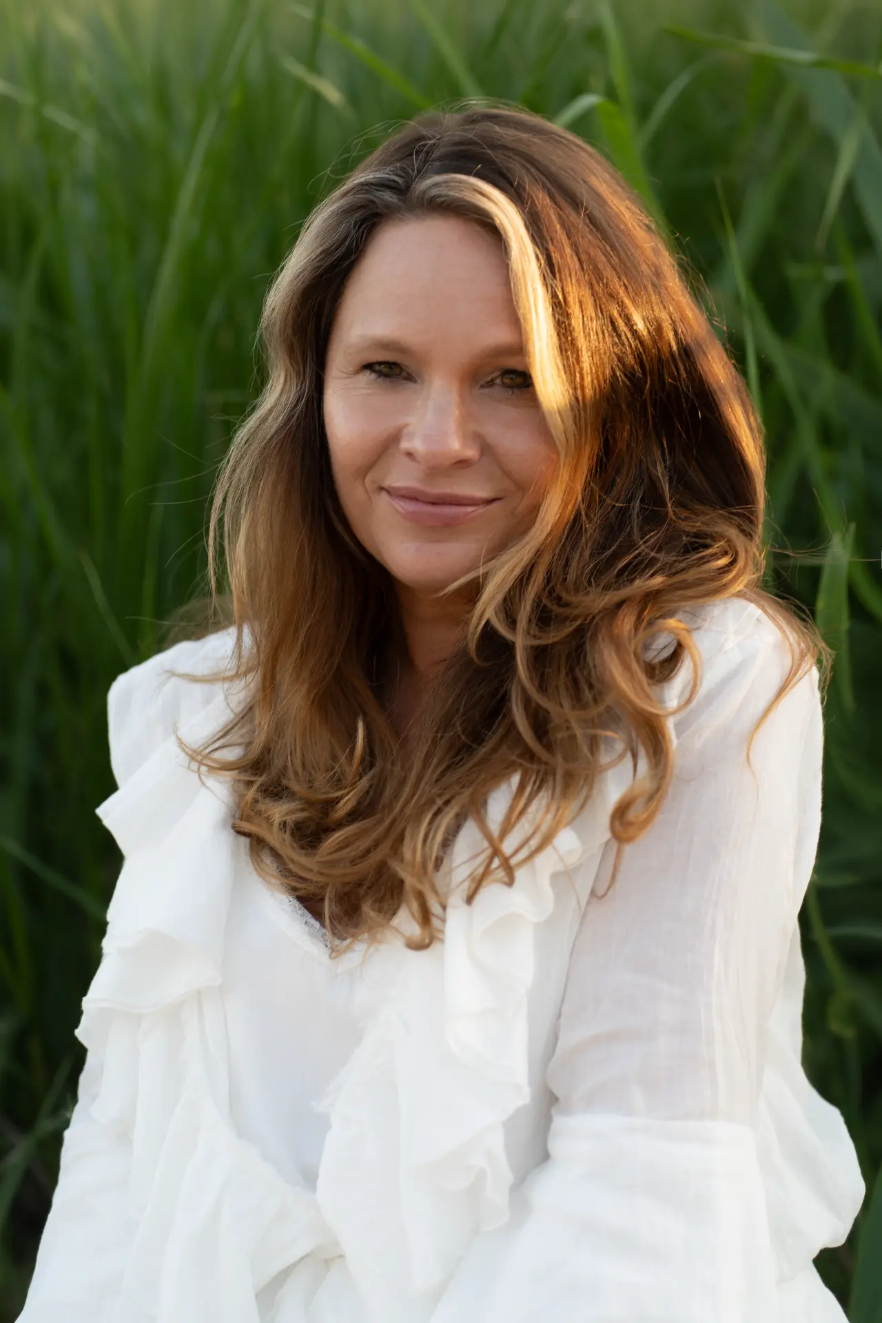Portrait of Marjolijn against deep green reeds
