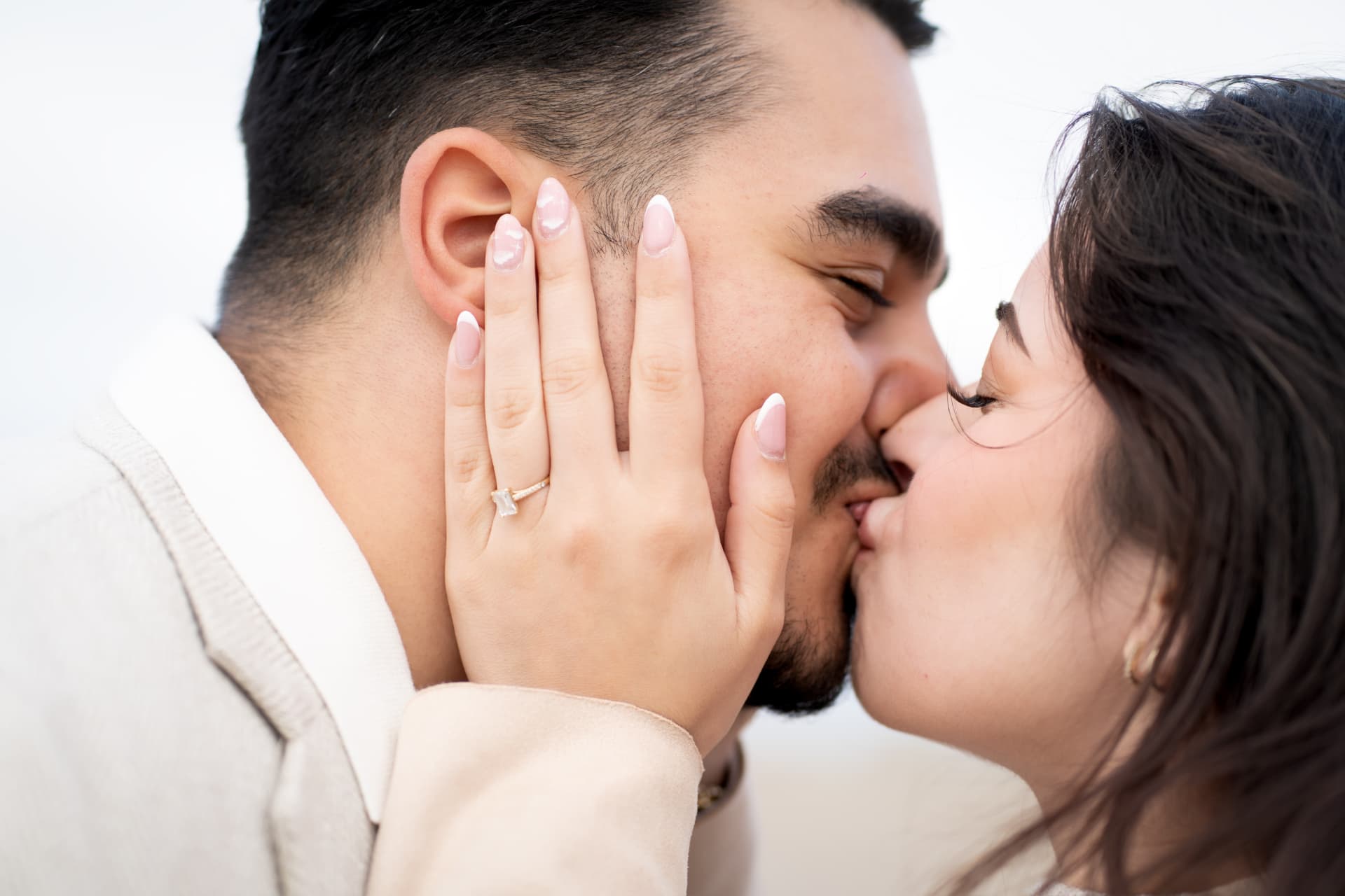 N and Y sharing a kiss with the engagement ring in view